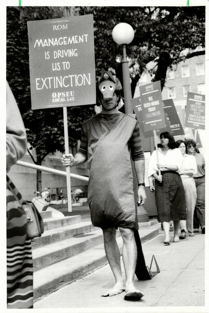 ROM protest: A museum worker costumed to represent a dinosaur joined about 100 union members who picketed the Royal Ontario Museum yesterday to protest lagging contract negotiations