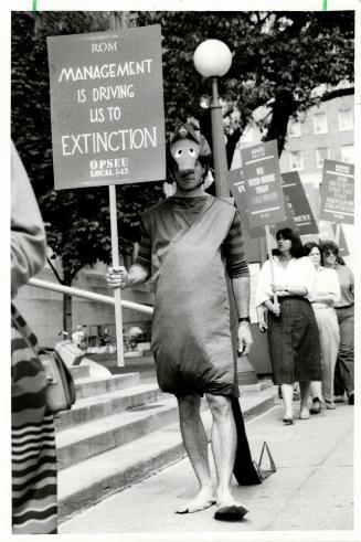 ROM protest: A museum worker costumed to represent a dinosaur joined about 100 union members who picketed the Royal Ontario Museum yesterday to protest lagging contract negotiations