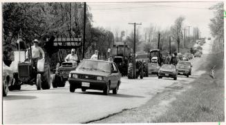 Tractor rally: Scarborough farmers driving tractors slow motorists' progress on Beare Rd