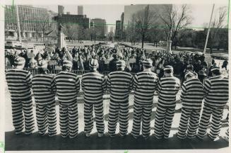 Symbolic protest: Demonstrators in prison uniforms show support at a Queen's Park rally for 11 prominent Armenians held captive in Soviet Union