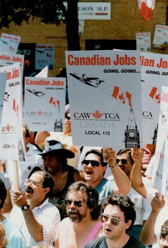 De Havilland protest: Workers worried about their jobs demonstrate outside Michael Wilson's constituency office in Etobicoke yesterday