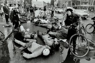 Mowed down: Bicyclists staged a die-in last week to protest Metro's refusal to accomodate bicycle lanes in Spadina's new design