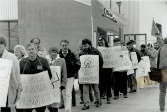 Seeking 'Green' jobs, About 100 laid-off union members rally yesterday outside the Caterpillar plant in Brampton, which will close next month. [Incomplete]