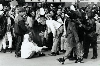 C.W. Jeffreys Secondary School principal Roger Veale, in white shirt, talks with student protesting teachers' job action