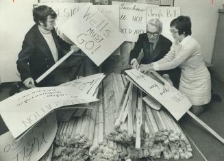 Members of the Ontario English Catholic Teachers Association prepare signs yesterday for today's march from Maple Leaf Gardens to Queen's Park. From t(...)
