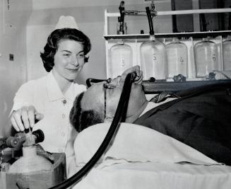 Elizabeth Slipp measures radium in Dr. M. B. Dymond's body