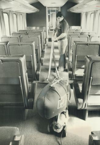 Wall-to-wall carpet in passenger cars is vacuumed by Eugen Ranberan