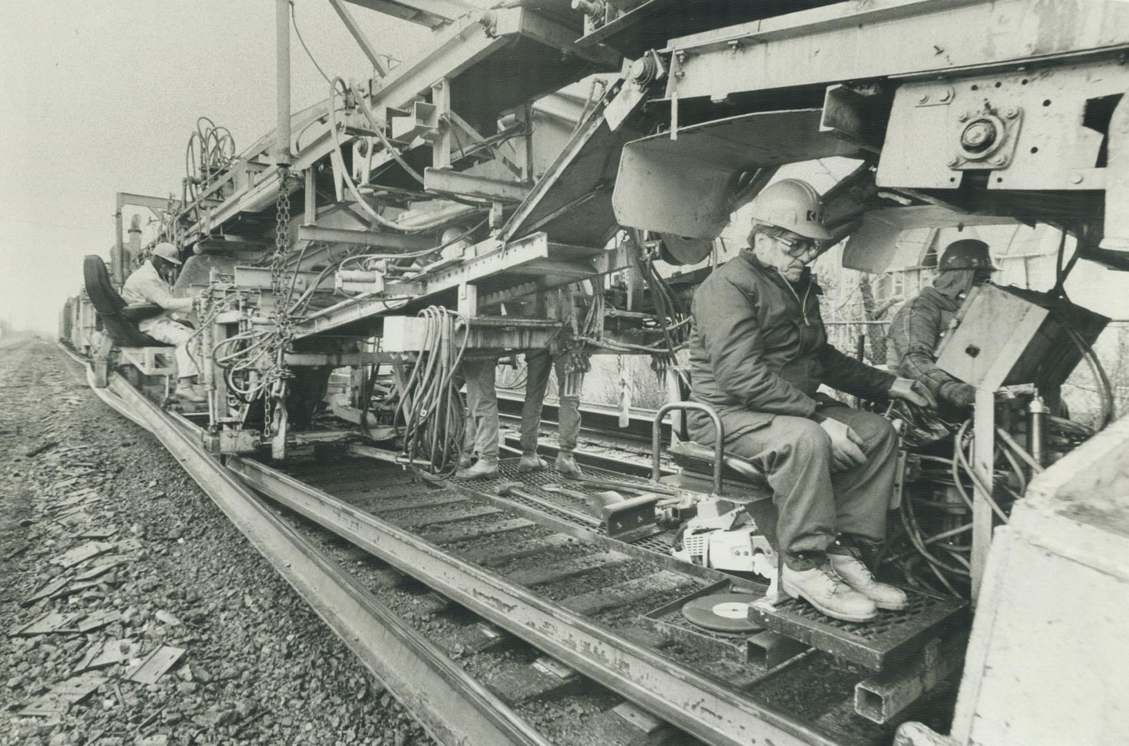 Making tracks: Track-laying machine is one of the technological developments that have enabled Canadian railways to cut costs and streamline their operations