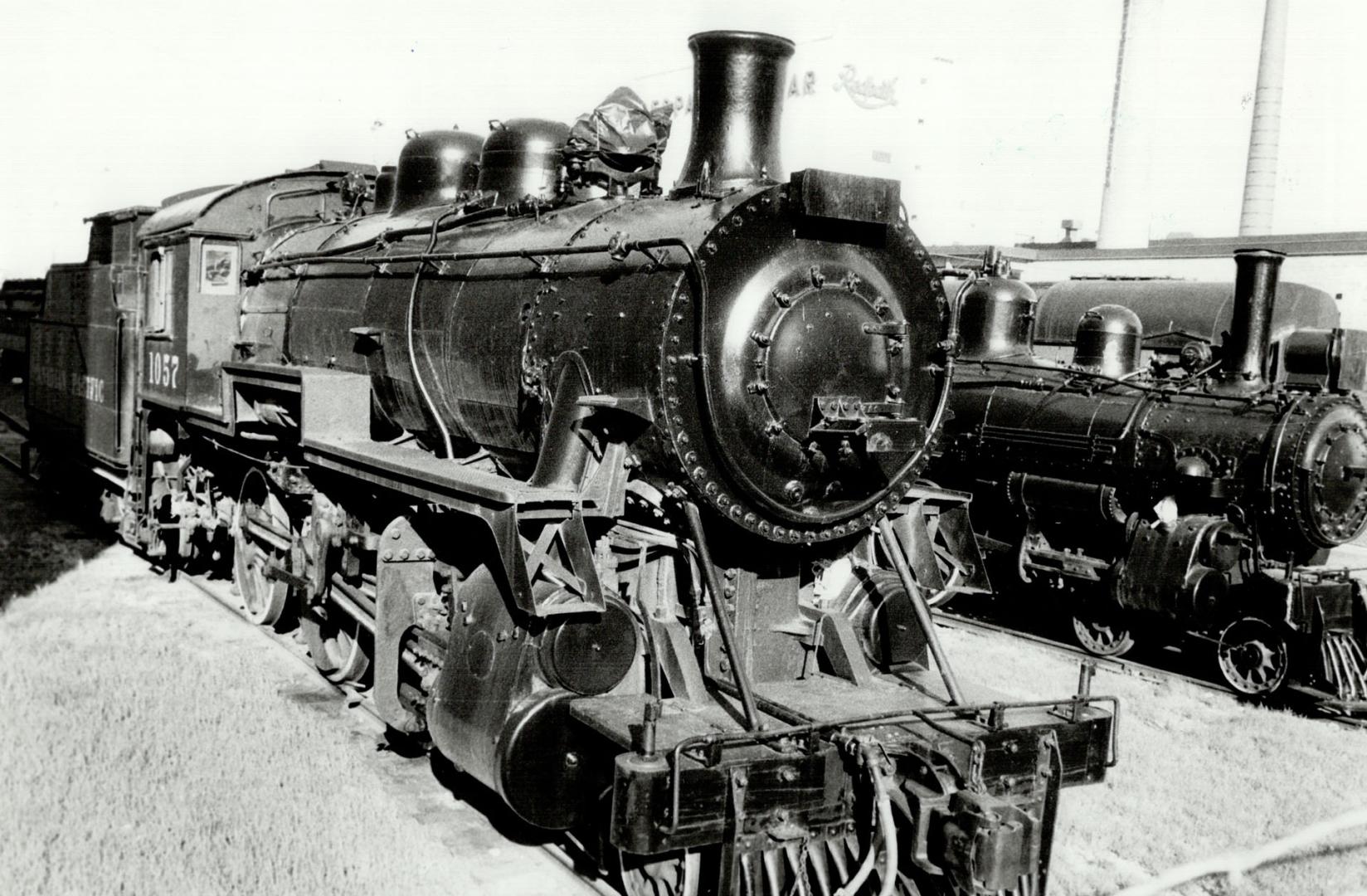 U.S.-bound? These two steam locomotives - representing the pre-diesel era in Ontario - sit in all their splendor on a spur line behind a Ontario Liquo(...)