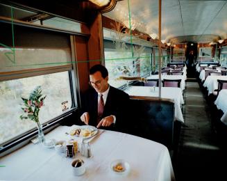 Rail rejuvenation: A rider samples some of the breakfast fare in the dining car of the refurbished Canadian en route from Montreal to Union Station yesterday