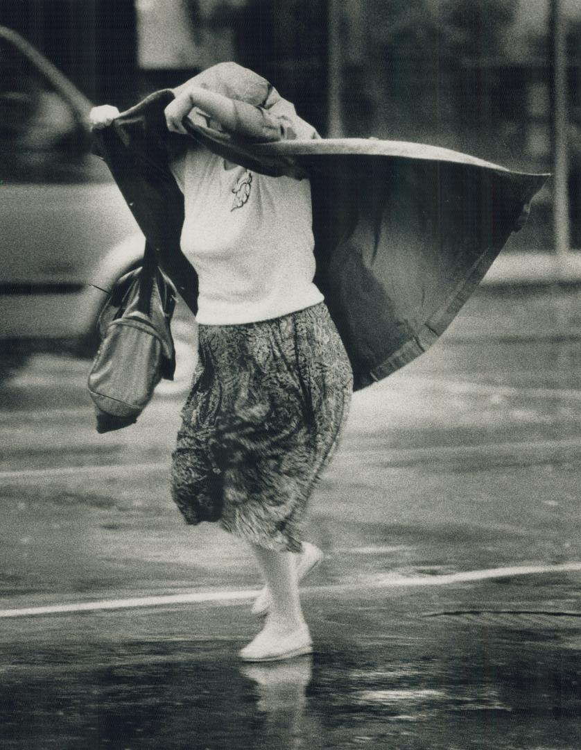 Soggy tuesday: Yesterday's balmy weather that turned to heavy rainfall shortly after noon left many pedestrians in the downtown area ill prepared to protect themselves