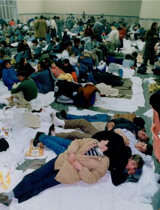 Like a bedraggled mass, an army of Albanian refugees must camp out in a Brindisi ferry terminal with one washroom and no blankets. They need everythin(...)