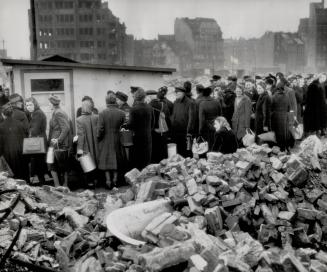 Food is uppermost in the minds of these people in Hamburg as they line up to get their rations