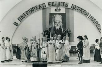 A Hugh Portrait of Josyf Cardinal Slipyj, leader of the world's 8,000,000 Ukrainian Catholics, towered over the open-air High Mass celebrated by Canad(...)