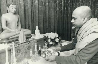 Yen Dhamminka, a Buddhist monk, worships in Scarborough temple