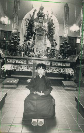 Buddah's birthday: Derek Chen, 7, celebrated by meditating near the Kuan Shih Yin Buddah at the Cham Shan Temple on Bayview Avenue, Thornhill