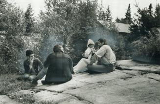 At Camp Kirjatharba on Round Lake near Pembroke, the leader of the Jesus People's conference, Robert Vellick, 39, (right) discusses with visitors the (...)
