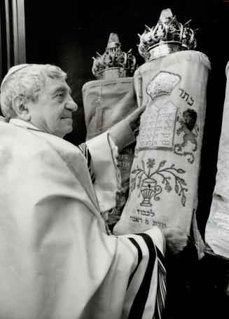 Happy 5,740, Frank Rock holds up a Torah scroll at the synagogue at the Baycrest Centre for Geriatric Care on Bathurst St. The scroll plays an importa(...)