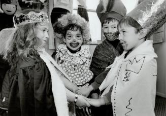 Beth David Synagogue students Amanda Fleischer as Queen Esther, left, Yoni Halpern as the clown, Jeremy Silver as Haman and Yoni Schumacher as King Ac(...)