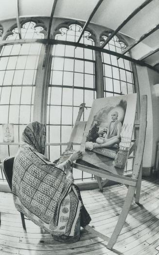 Woman member of the Hare Krishna movement, Tribhuvanesvari Devi Dasi, sits in tranquility, painting a holy picture, in the old church on Avenue Rd. in(...)