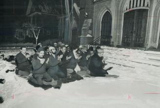 Locked-out Moslems pray in the snow, Nineteen Moslems, with shoes off, kneel on prayer rugs laid on the snow outside Jami' Mosque in last night's 32-d(...)