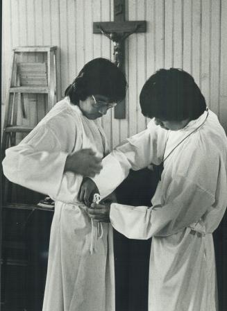 Ministry students: Two students at the Kisemanito spiritual centre in northern Alberta, Edward Moonias, an Ojibway Indian, and Jim Andrew, a Salish Indian, prepare for Mass