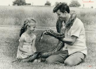 Great snakes alive! Jennifer DeGruchey, 6, seems somewhat lukewarm toward a boa constrictor being shown her by Sam Persi at Meadowvale Town Centre on (...)
