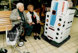 Stan and Rae Litman look in amazement at the $70,000 robot Schlep, the newest employee at the Baycrest Centre for Geriatric Care. On duty from 7 a.m. (...)