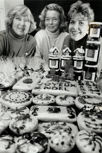 Plum sweet: From left, Blair McLorie, Gill Telchman and Lisa Stuart, with goodies for the Sugar Plum Fair