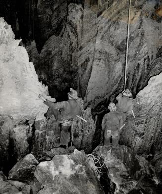 Miners do some underground Alpine climbing, preparatory to installing new mining equipment