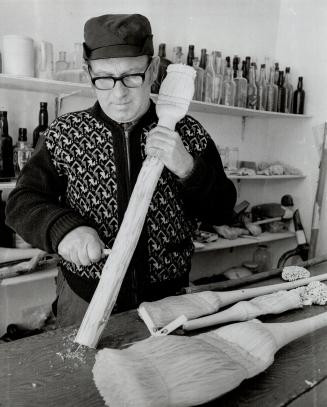 Heber Heffern, In his small shop in Salvage - He wittles birch log or stick one piece brooms - all bristles are cut and are all part of same stick - kids watch