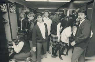 St. Thomas Acquinas Sec. School, Bramalea. Class change time, crowds in the hallways, and walk through the mind puddles in between portables