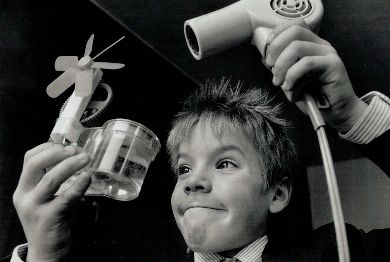 Zachary case, a Grade 5 student at Sterling Hall School in Don Mills, demonstrates his entry in school's annual science fair yesterday. The exhibit, c(...)