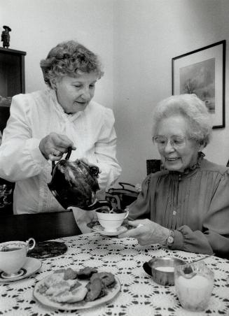 Sharing Tea: Betty Schmeier, left, and Dorothy Ohi share a household and companionship after being matched by Sharing, a service that finds compatible partners