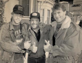 Life's grand: Todd Publicover, 20, the youngest man aboard the Cape Aspy, Tim Parks (middle) and Larry Wentzell give a thumbs-up to life after their narrow escape from drowning