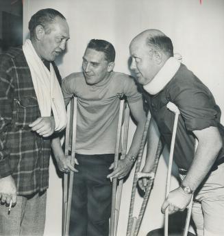Ken Graham, left, who broke his arm in accidential launching of ship at Collingwood May 29, discusses inquest with Roy Knox, centre, and Lorne Jago. K(...)
