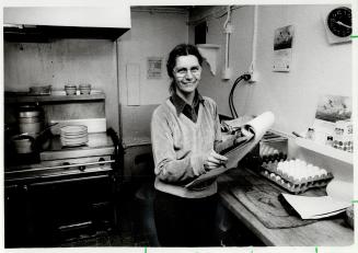 What's cooking? Carol Smith, ship's cook on the lake freighter Meldrum Bay, makes up crew's shopping list before the ship sets sail for Thunder Bay