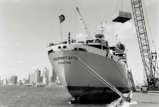 Dockside Rendezvous, The Soviet ship Novomirgorod, loading nuclear plant equipment for Bombay, India, at Pier 51, is one of three ships from distant lands presently in Toronto