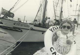 Victoria Leigh, 4, poses beside the brigantine S