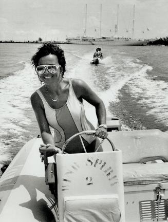 A pair of cruise ship passengers get a little closer to the Caribbean, in a rubber banana boat towed by a jet-ski