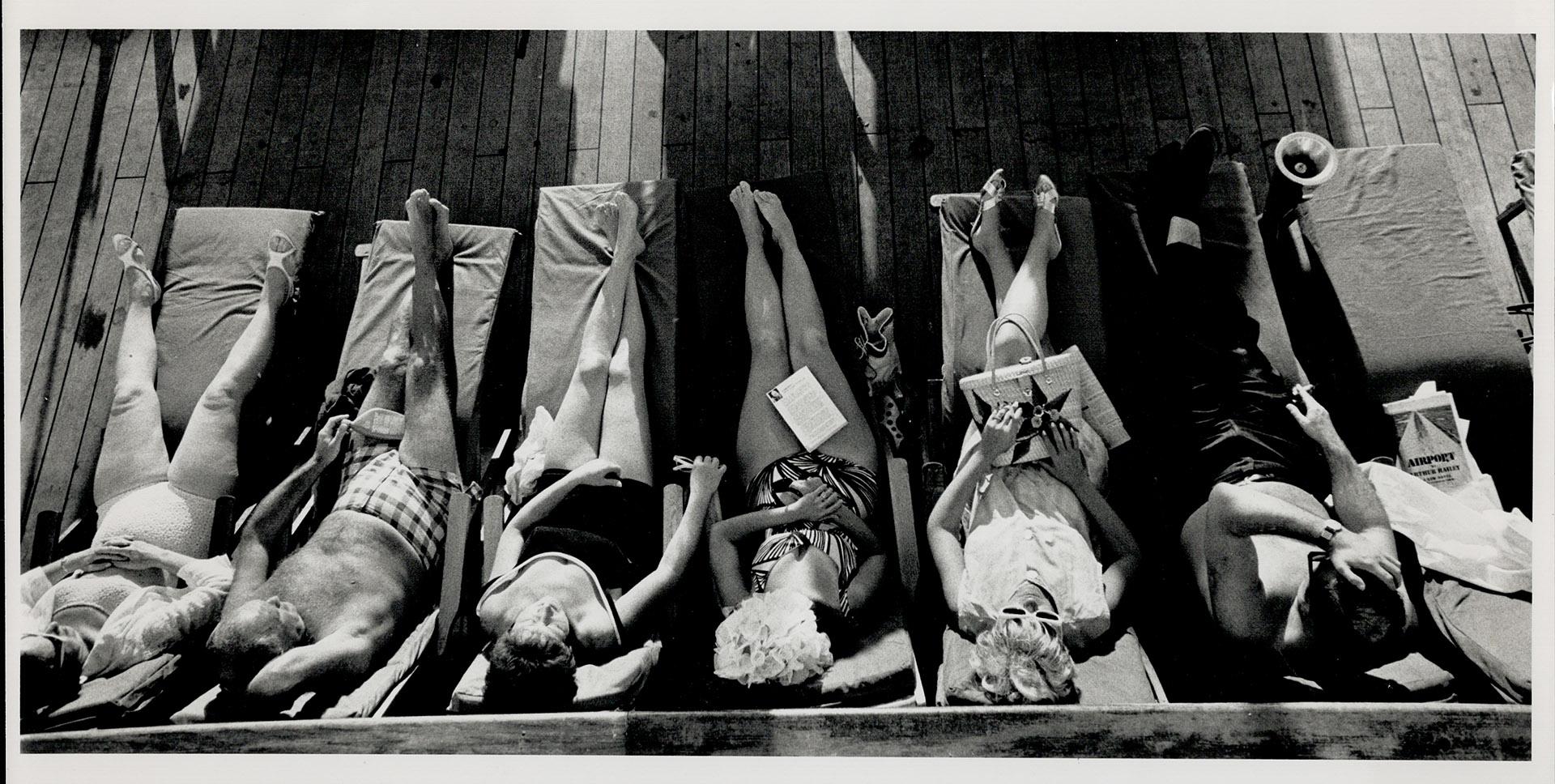 just vegging out: Cruise passengers (left) relax and soak up the sun