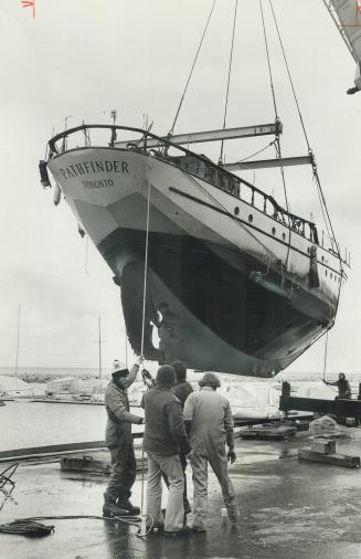 Winter vacation, The 25-ton brigantine Pathfinder is hoisted out of Lake Ontario by a 50-ton crane to dry dock at Port Credit Marina. The 60-foot squa(...)