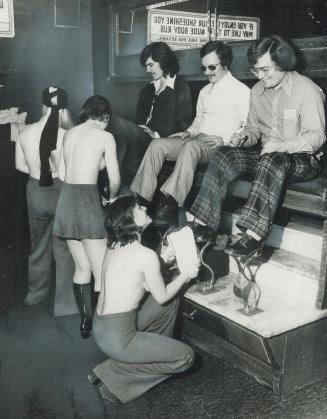Buffing Shoes In The Buff, Topless shoeshine girls have come to Toronto - and Charlotte (Nutsy) Webb, 19, of Toronto was working on Michael J. Freeman(...)