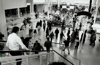 'Tis the season: Consumers at the Sherway Gardens mall in Etobicoke take advantage of Sunday store hours to shop yesterday