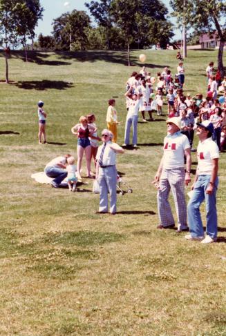 Canada Day. Adult mid fairground is George Rigg executive director of Boys & Girls Clubs Toronto. July 1982 Riverdale Park