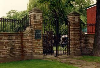 Image shows the metal gates to the cemetery. 