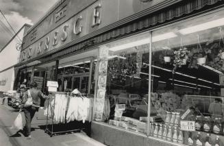 Better days: S.S. Kresge at Gerrard St. and Coxwell Ave. Joins the sidewalk sales of the '80s but still evokes a dry-goods smell of stores from another era