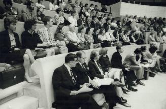 Members of the audience at City Hall last night listen intently to arguments for and against Sunday shopping