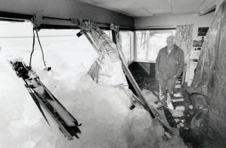 On the rocks: Fred Hornsby, 59, surveys the damage done to his Keswick retirement home, when at least 15 tonnes of Lake Simcoe ice crashed through the front of the house early on Good Friday morning