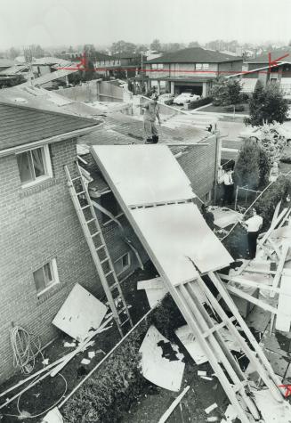 Among the damaged houses in yesterday's storm were these two on North York's Rockland Dr. No injuries were reported but homes and roads were flooded, (...)